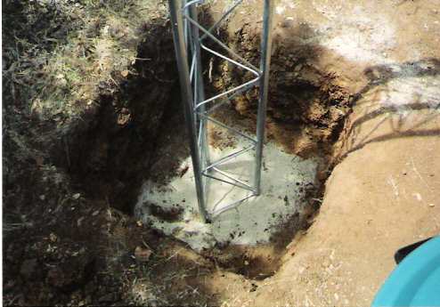 The hole is dug by hand to make ready for lots of concrete and a Rohn 25 tower.
